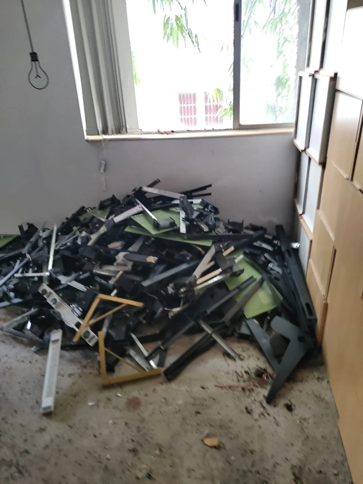 Office Relocation Services in Marathahalli Pile of sorted aluminum and iron frame elements collected during office dismantling services in Marathahalli