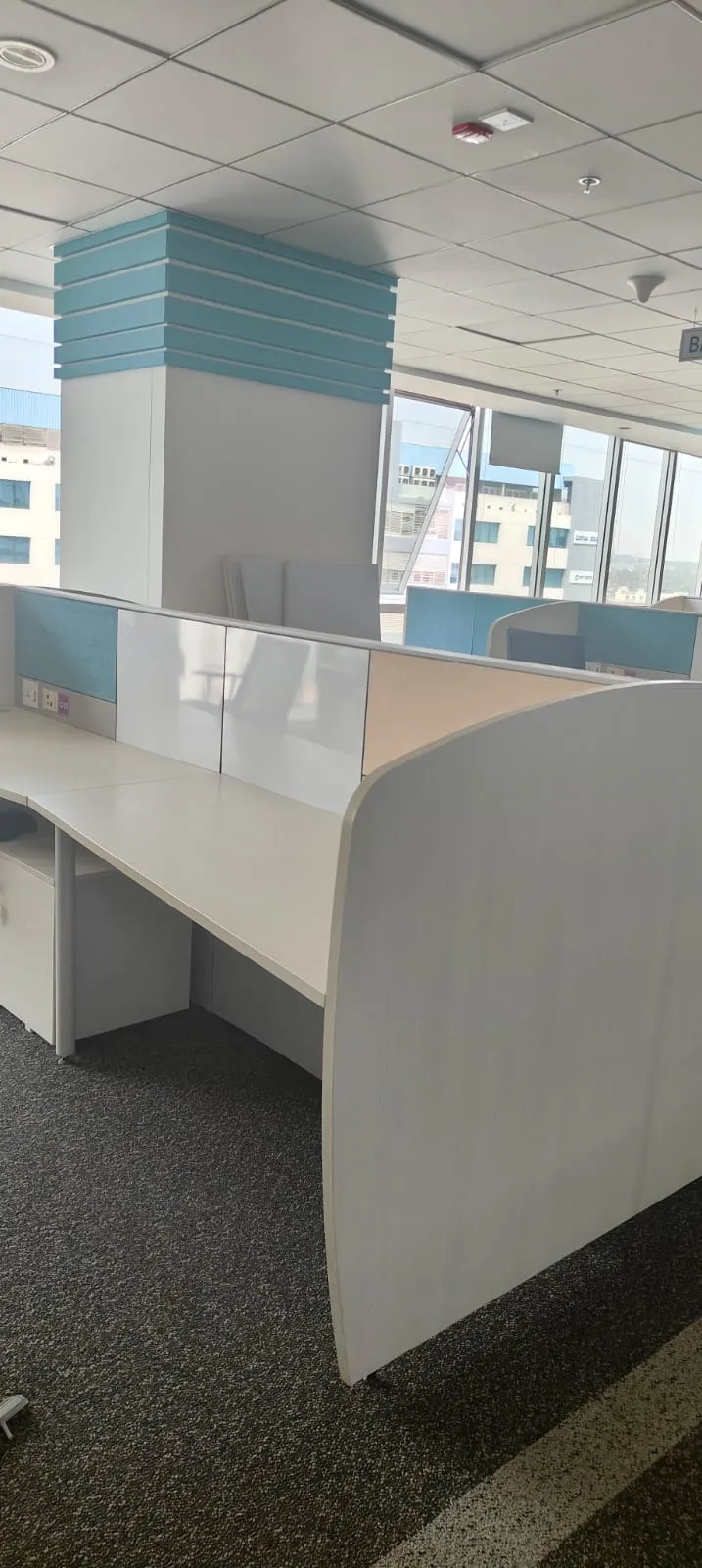 Open Plan Desk Demolition | Workstation Removal Marathahalli Empty modern open-plan linear desk systems configured inside an IT hub before workstation removal Marathahalli.
